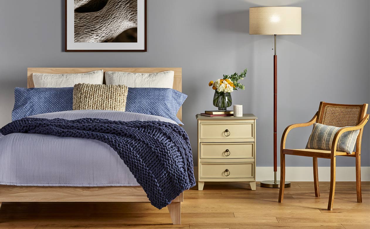 Bedroom with new oak hardwood flooring from Flooring America